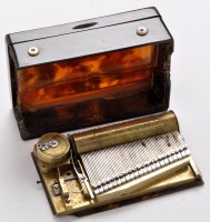 Lot 380 - A 19th Century tortoiseshell musical snuff box,...