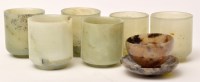 Lot 518 - Six Chinese green hardstone beakers, the...