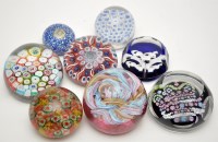 Lot 570 - Eight glass paperweights, including:...