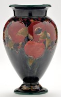 Lot 604 - Moorcroft pear-shaped 'Pomegranate' vase, deep...