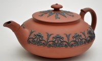 Lot 611 - Wedgwood 'Rosso Antico' squat teapot and cover,...