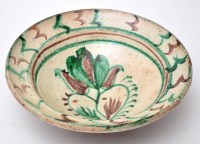 Lot 642 - Green and aubergine glaze bowl, ivory ground...