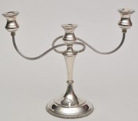 Lot 679 - An Elizabeth II twin branch candelabra, by...