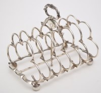 Lot 702 - A George IV seven bar toast rack, by Joseph...