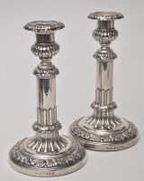 Lot 711 - A pair of George III candlesticks, by John and...