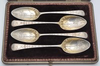 Lot 724 - Four George III silver gilt serving spoons, by...