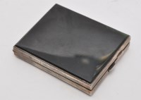 Lot 756 - A white metal and agate cigarette case,...