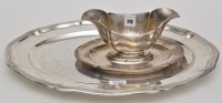 Lot 776 - A German 830 standard sauce tureen, on fitted...