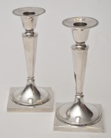 Lot 780 - A pair of Continental silver candlesticks,...