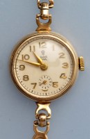 Lot 815 - Tudor Royal: a lady's 9ct. gold bracelet watch,...