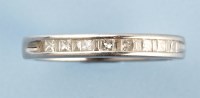 Lot 844 - A diamond half hoop eternity ring, set with...