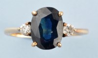 Lot 846 - A sapphire and diamond ring, the oval facet...