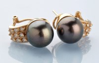 Lot 852 - A pair of cultured black pearl and diamond...