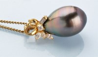 Lot 853 - A cultured black pearl and diamond pendant,...
