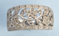 Lot 857 - A diamond and yellow metal ring, in floral...