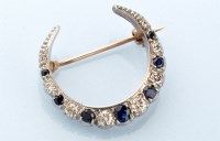 Lot 862 - A diamond and sapphire set Edwardian crescent...