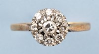 Lot 863 - A diamond cluster ring, set with nine...