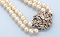 Lot 864 - A double row cultured pearl necklace, the...