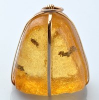 Lot 868 - A 19th Century insect inclusion amber pendant,...