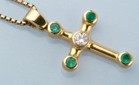 Lot 880 - An emerald and diamond set 18ct. yellow gold...