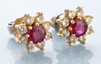 Lot 886 - A pair of ruby and diamond cluster stud...