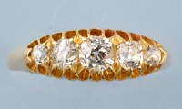 Lot 890 - A five stone diamond ring, the graduated old...