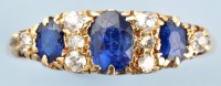 Lot 891 - A sapphire and diamond ring, the three oval...