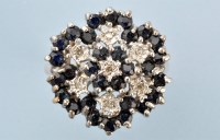 Lot 894 - A sapphire and diamond dress ring, all in...