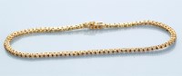 Lot 899 - A diamond line bracelet, each link set with...