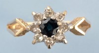 Lot 901 - A sapphire and diamond cluster ring, the...