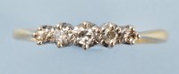 Lot 902 - A five stone diamond ring, the graduated...