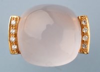 Lot 925 - A star rose quartz and diamond ring, the...