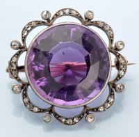 Lot 926 - An Edwardian amethyst and diamond brooch, the...