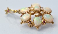 Lot 934 - An opal, ruby and diamond brooch/pendant, of...