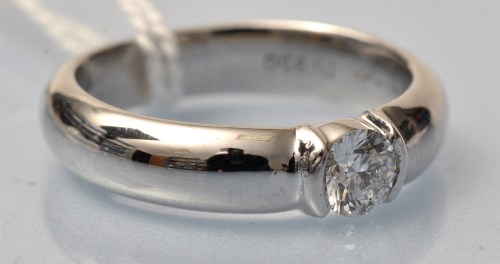 Lot 937 - A Tiffany solitaire diamond ring, the...