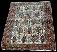 Lot 952 - An Abadeh rug, with vases of flowers on white...