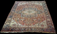 Lot 961 - A Heriz carpet, with bold geometric floral...