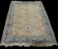 Lot 964 - A Tabriz carpet, the light coloured ground...