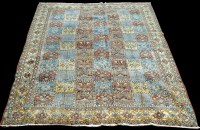 Lot 970 - A Moud carpet, the field with panels of floral...