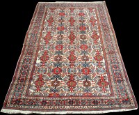 Lot 972 - A Caucasian carpet, with medallions on ivory...