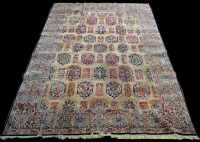 Lot 973 - A Kerman carpet, with floral panels to field,...