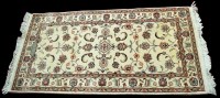 Lot 979 - A Tabriz rug, with scrolling floral design on...