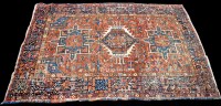 Lot 980 - A Heriz rug, with triple geometric medallion...