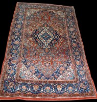 Lot 990 - A Kashan rug, full floral decoration on red...