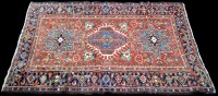 Lot 993 - A Heriz rug, decorated with geometric floral...