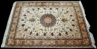 Lot 996 - A Tabriz rug, the ivory ground with scrolling...