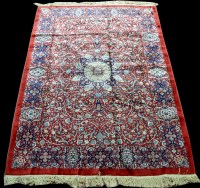 Lot 1002 - A Tabriz rug, the central rose medallion...