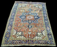 Lot 1003 - A Heriz carpet, with geometric design and...