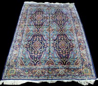 Lot 1004 - A Kirman carpet, with large panels of floral...