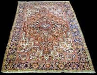 Lot 1008 - A Heriz carpet, with bold geometric floral...